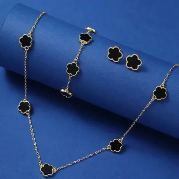 Shop the Flower & Five-Leaf Clover Bracelet, Earrings & Necklace Set for Women. This elegant three-piece jewelry set features unique designs in zinc alloy, perfect for casual and party wear. A stylish and lucky accessory for any occasion
