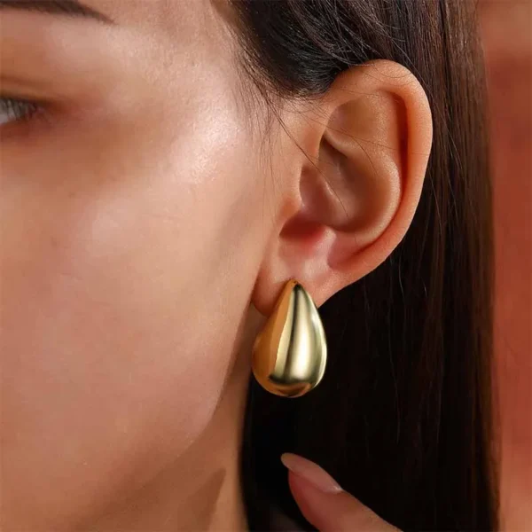 Add a touch of elegance to your look with these Vintage Gold Chunky Water Drop Dome Earrings. Featuring a bold, glossy teardrop design, these stylish stud earrings are perfect for any occasion, from casual outings to special events