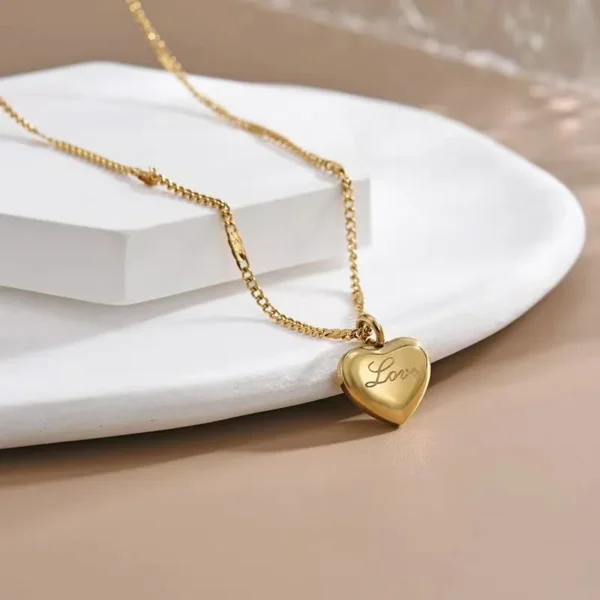 Shop the Trendy Gold Heart Pendant Choker Necklace for Women. Elegant and stylish, this zinc alloy necklace features a delicate heart pendant on a thin link chain, perfect for any occasion. A must-have fashion accessory for women