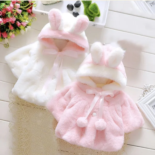 Keep your baby girl warm this winter with the Girls' Winter Cape. Featuring an adorable ear fleece hood, this wool shawl combines coziness and style.