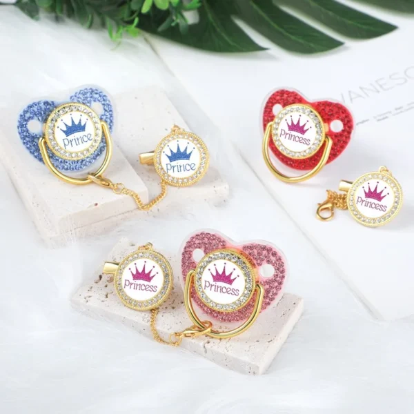 Keep your baby soothed and stylish with the Crown Silicone Newborn Pacifier Clip Set. BPA-free, ergonomic, and adorned with rhinestones for an elegant touch.